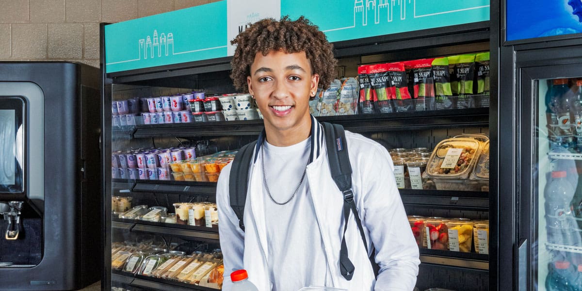 Student standing inside of c-store